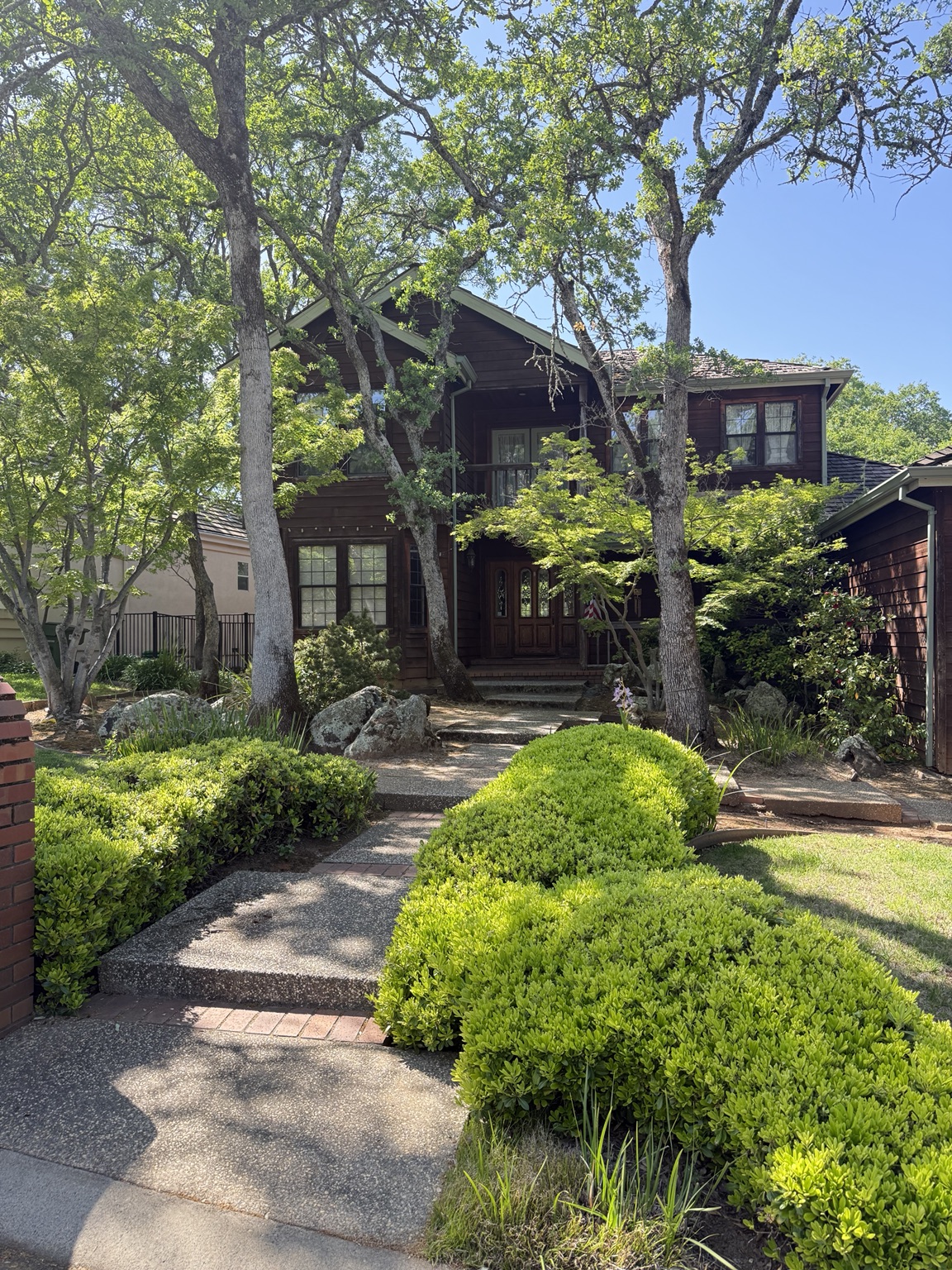 Woodland home with a landscaped front walk